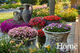 Earthy vessels and urns make bold statements. Photo by Jack Coyier, courtesy of Ted Lare Design + Build. Large vessels and urns filled with colorful flowers