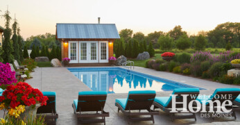An in-ground pool and pool house