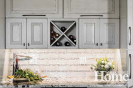 The new bar, which anchors one wall of the kitchen, is one of the homeowners' favorite features.