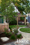 The welcoming backyard offers numerous spots to stop and smell the flowers.