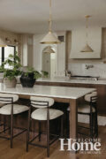 Two large kitchen islands make efficient use of space. One is for prepping meals, and the other is for dining.