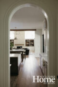 An arched doorway with simple trim can soften the straight lines and unadorned edges while maintaining a minimalist style.