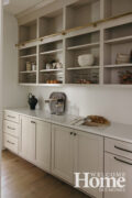 The pantry behind the kitchen has plenty of storage space.