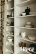 The pantry behind the kitchen has plenty of storage space.