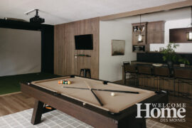 The lower level is all about entertainment, games, and the golf simulator.