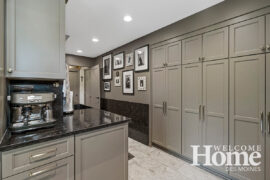 An extension of the kitchen design, the combined laundry room and pantry also features a coffee station and extensive counter space for prep work.
