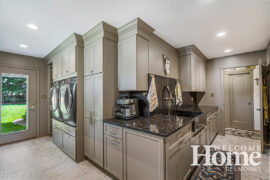 More than triple the original laundry room's size, the new space boasts raised washer and dryer and a wealth of storage.