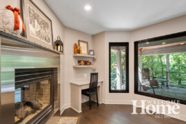 The double-sided fireplace creates a cozy corner for working, dining, or enjoying the view.