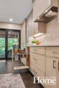 Beside the stove, a full-height pullout features knife and utensil storage.