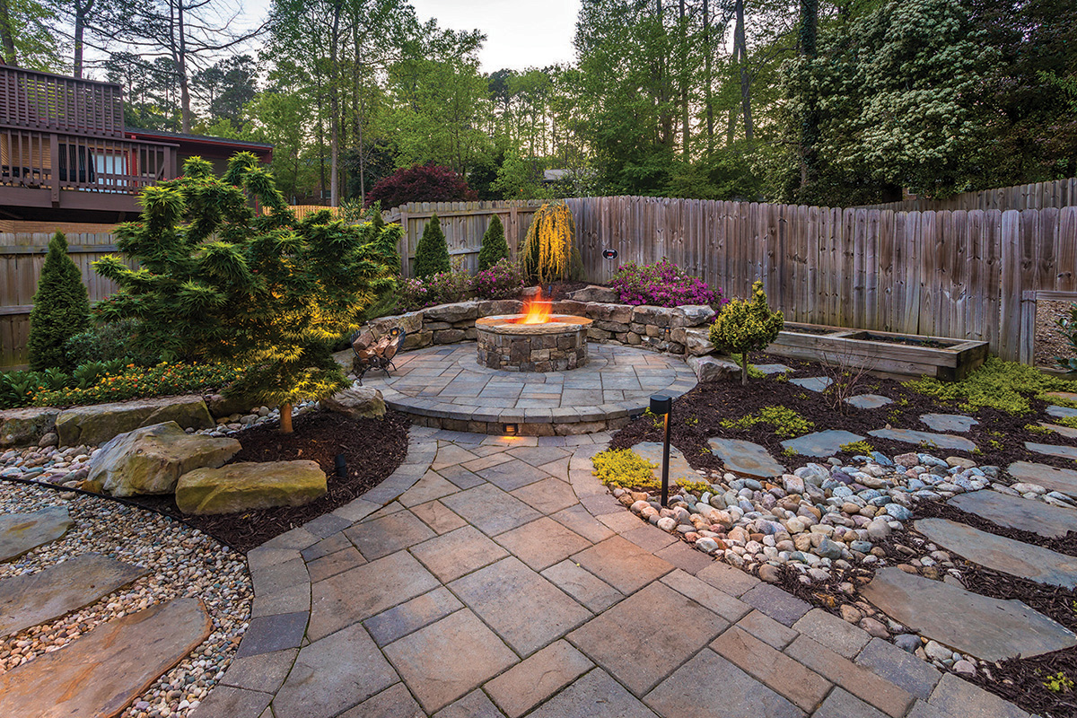 A backyard with ornate hardscaping